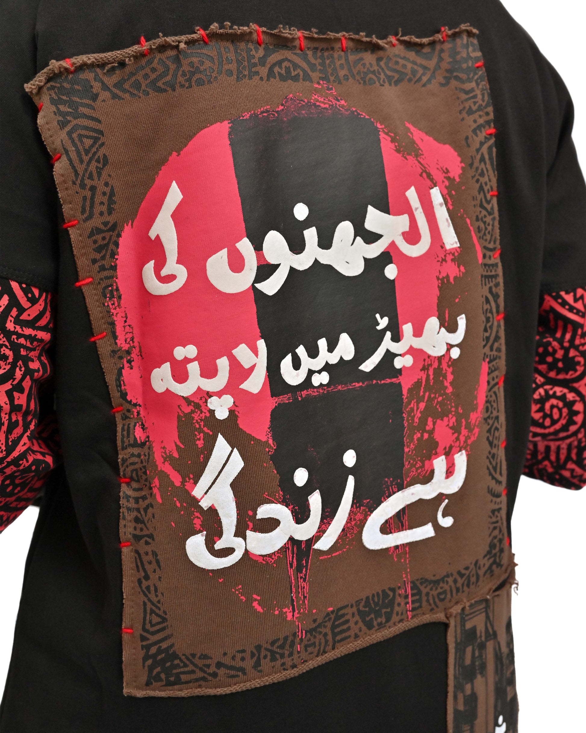 Person wearing "Lost in Grief" a Cream And Black graphic t-shirt with text on the back, standing against a white background made in pakistan