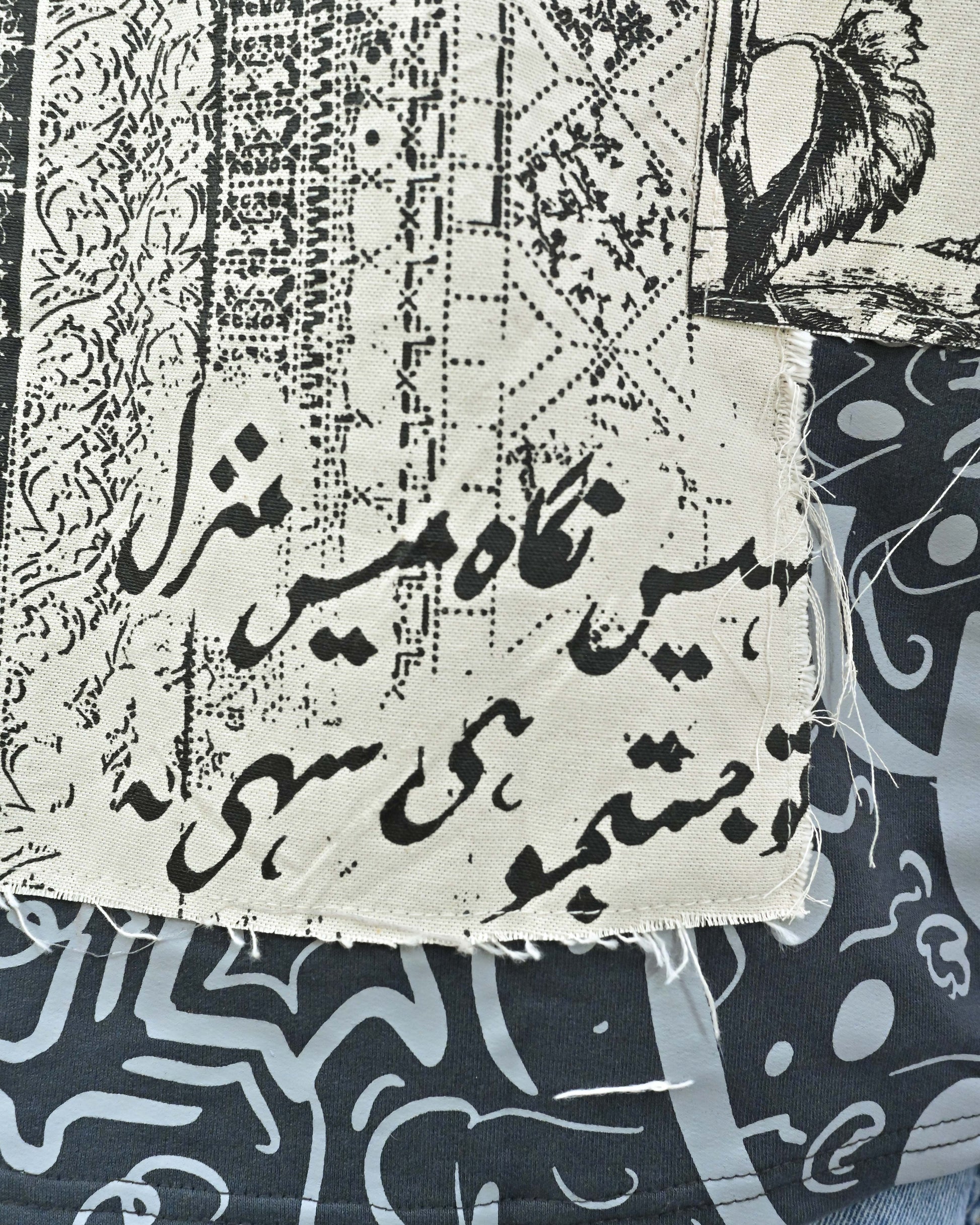 Person wearing "Ash Fade" a white graphic t-shirt with text on the back, standing against a white background made in pakistan