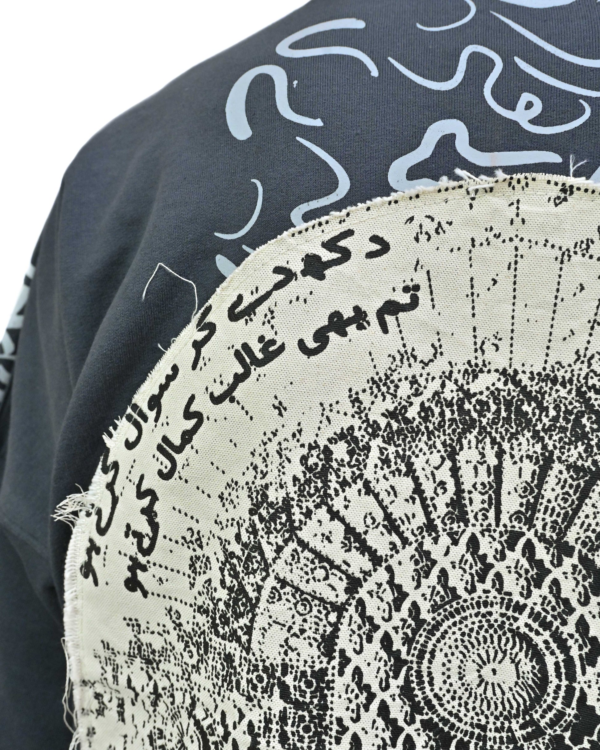 Person wearing "Ash Fade" a white graphic t-shirt with text on the back, standing against a white background made in pakistan