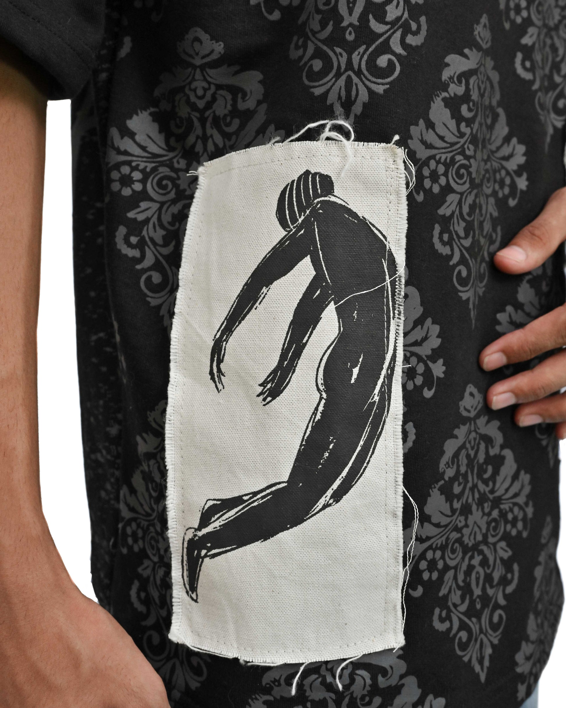 Person wearing "Black Verse" a white And Black graphic t-shirt with text on the back, standing against a white background made in pakistan