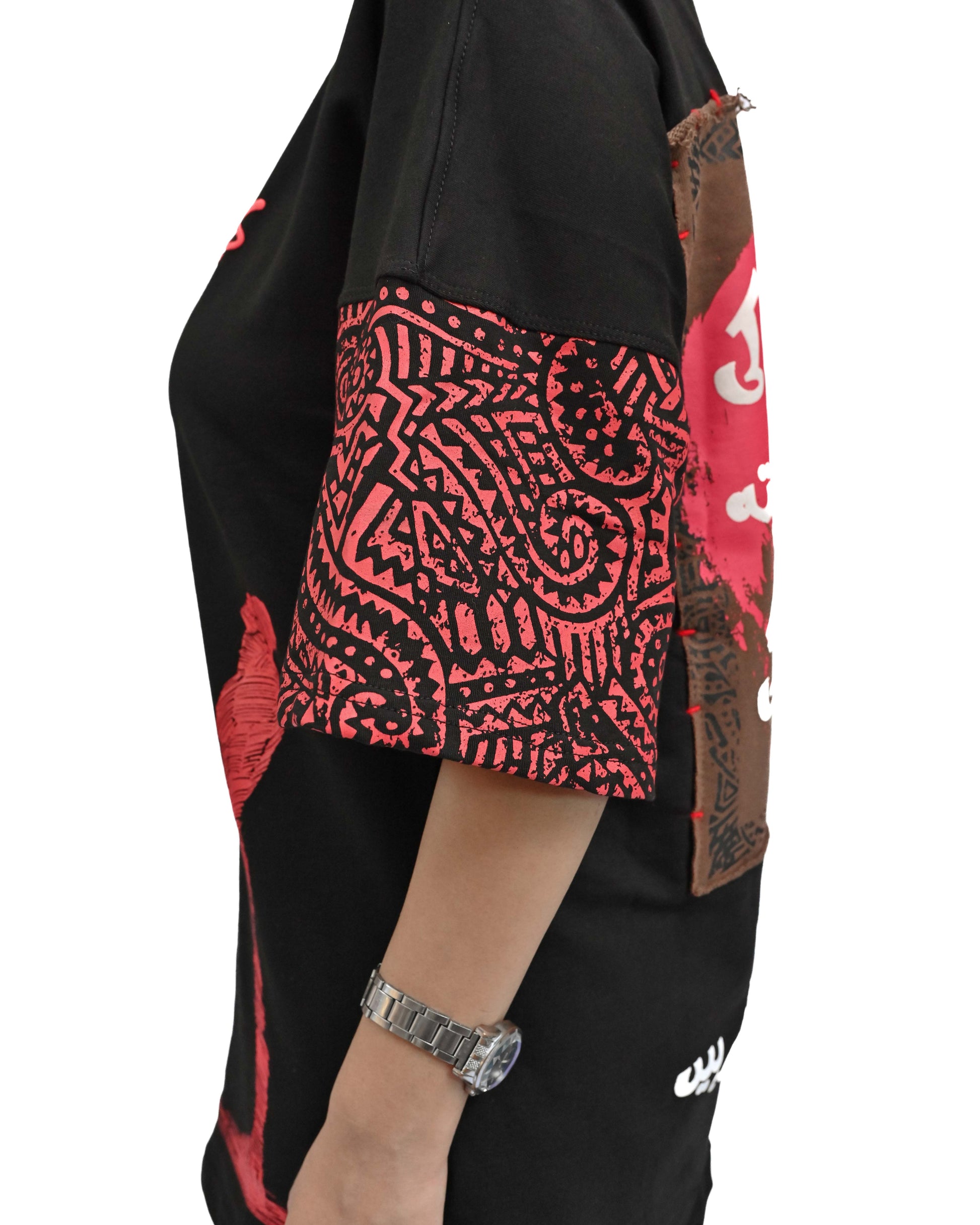 Person wearing "Lost in Grief" a Cream And Black graphic t-shirt with text on the back, standing against a white background made in pakistan