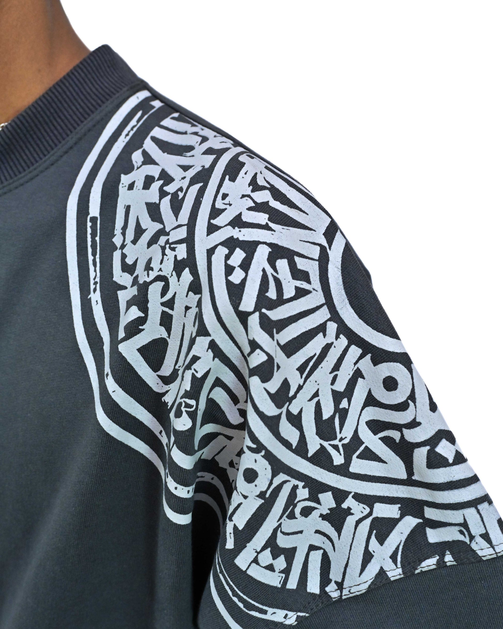 Person wearing "Ash Fade" a white graphic t-shirt with text on the back, standing against a white background made in pakistan