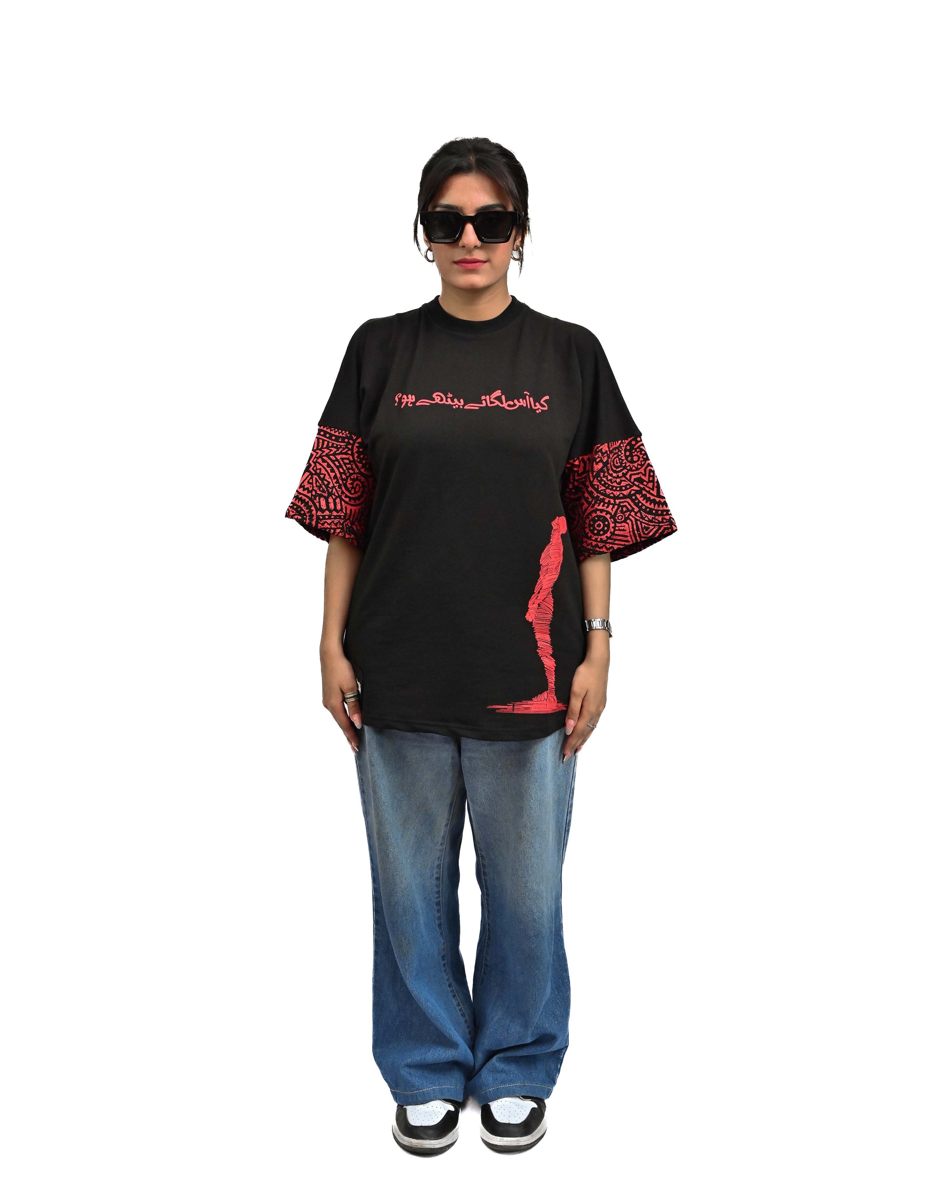 Person wearing "Lost in Grief" a Cream And Black graphic t-shirt with text on the back, standing against a white background made in pakistan