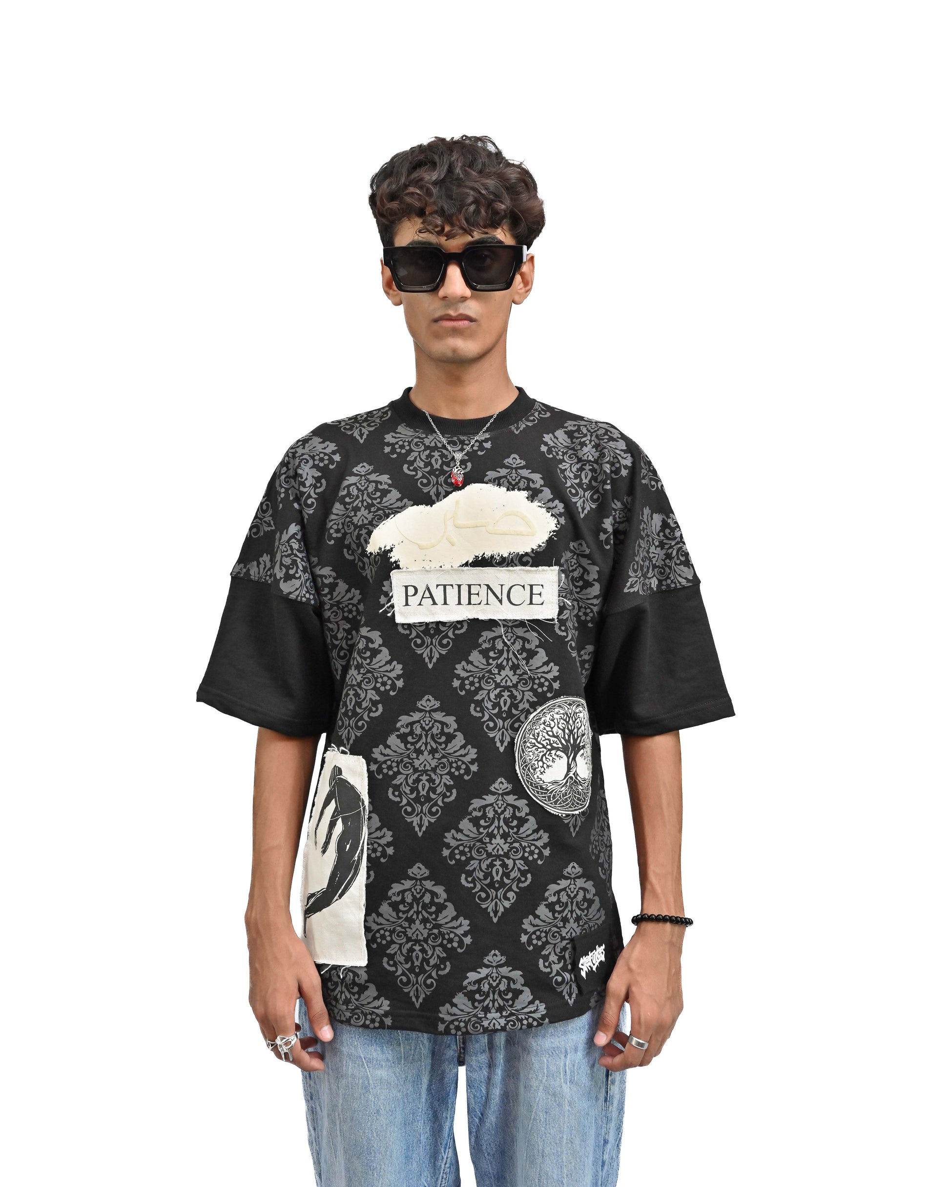 Person wearing "Black Verse" a white And Black graphic t-shirt with text on the back, standing against a white background made in pakistan