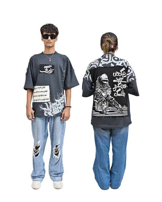 Person wearing "Stone & Spirit" a black and white graphic t-shirt with text on the back, standing against a white background.