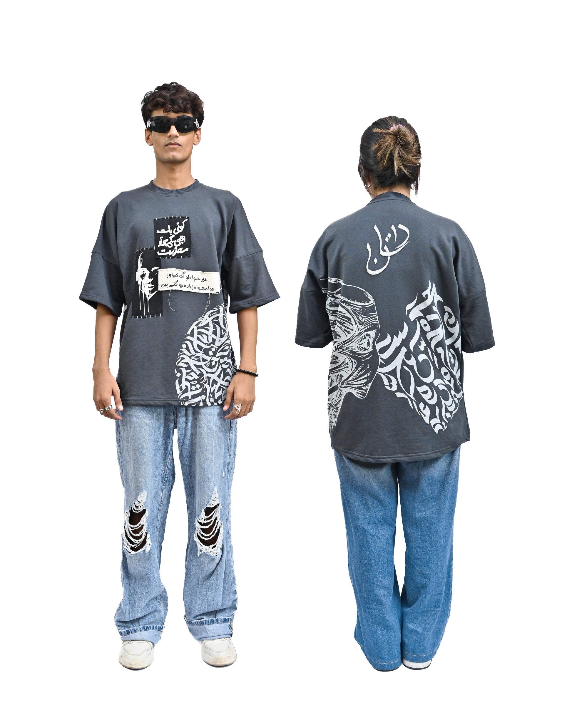 Person wearing "Chronicle" a white And Black graphic t-shirt with text on the back, standing against a white background made in pakistan