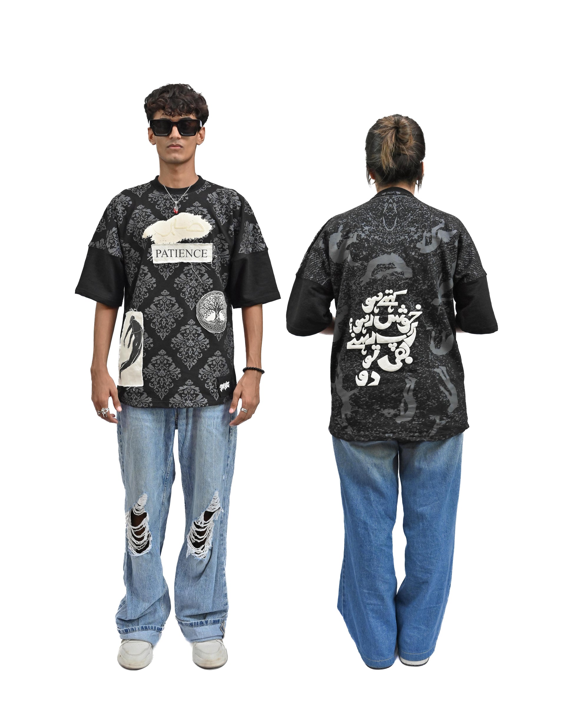 Person wearing "Black Verse" a white And Black graphic t-shirt with text on the back, standing against a white background made in pakistan